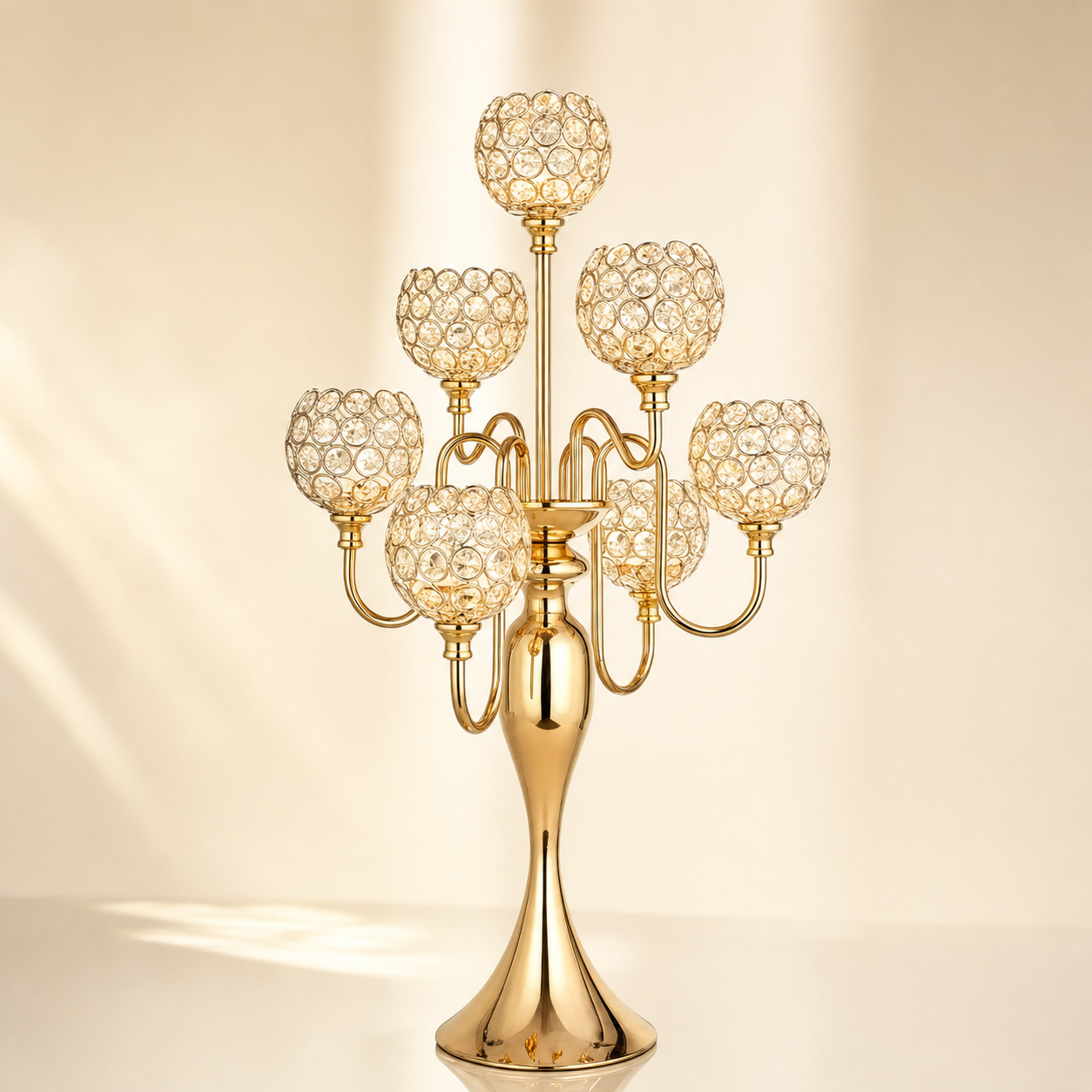 Seven-arm gold candelabra with clustered crystal ball candle cups