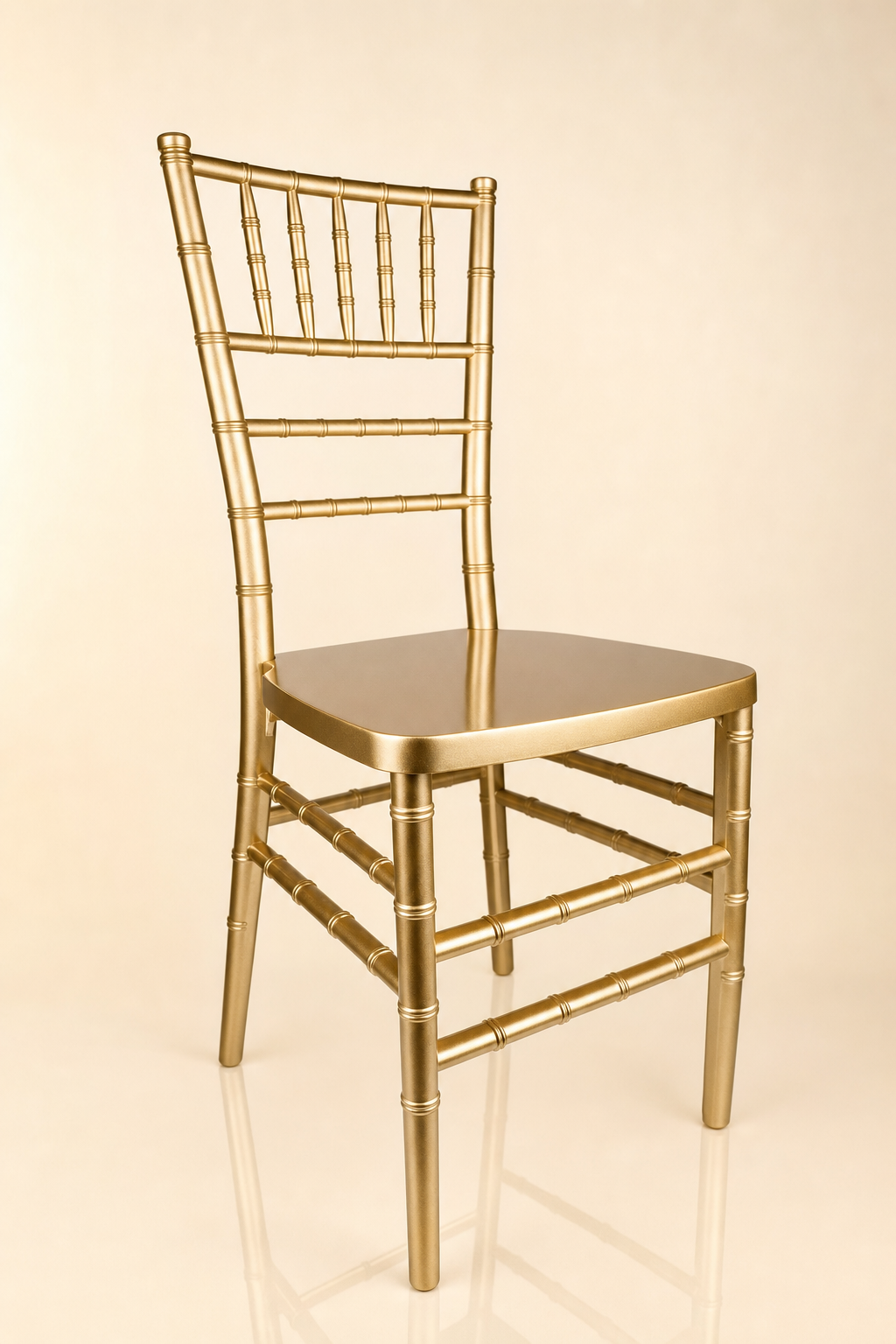 Classic gold Chiavari ballroom chair with bamboo-style spindle back