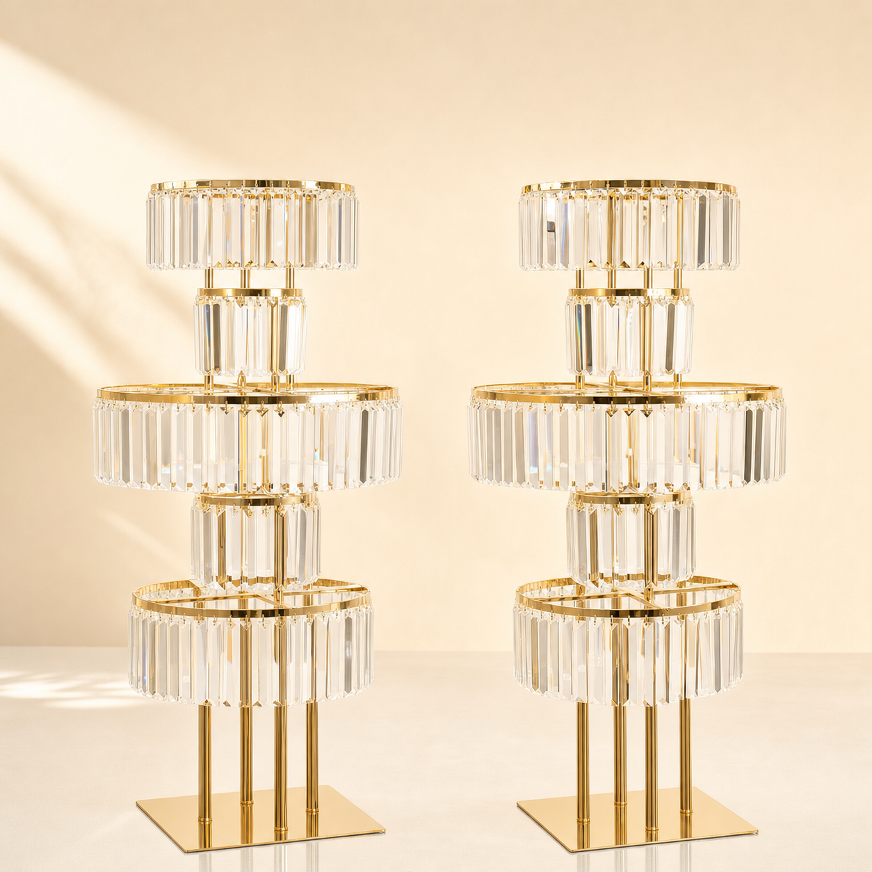 Pair of tall tiered crystal chandelier centerpiece risers with gold frame