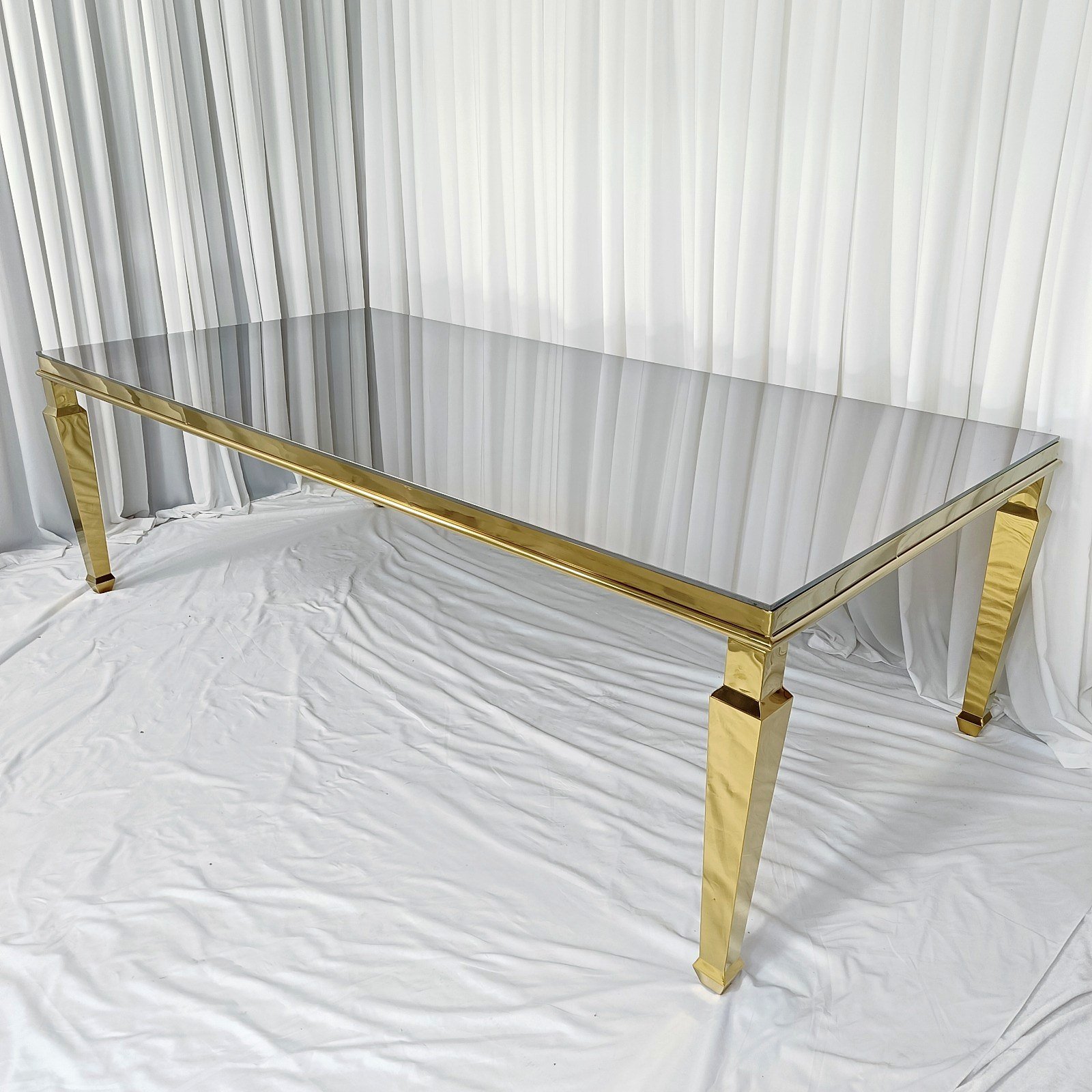 Rectangular mirror-top cake table with gold frame and tapered gold legs