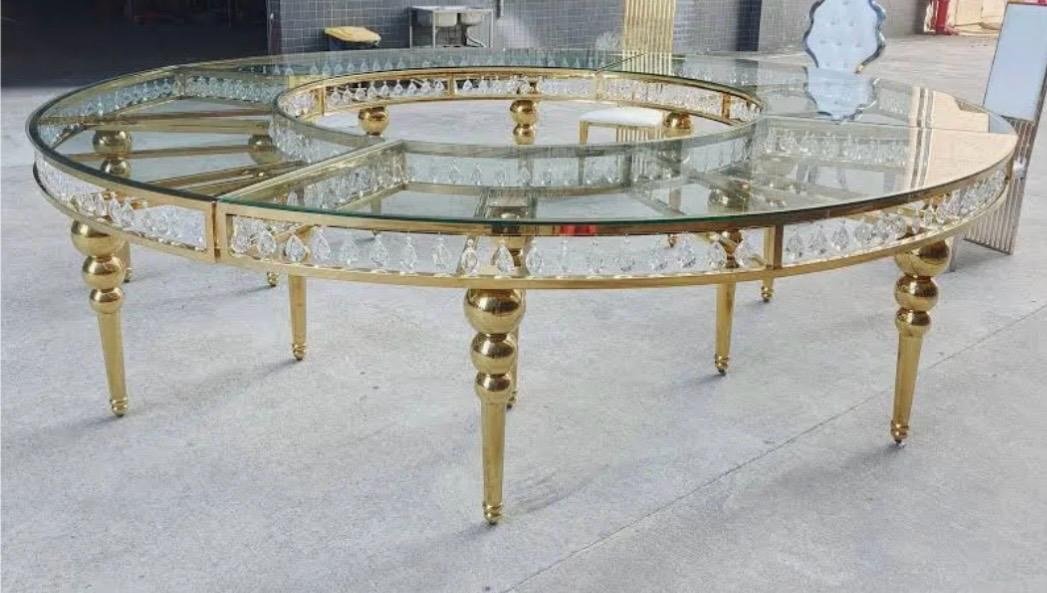 Round crystal-trimmed banquet table with glass top