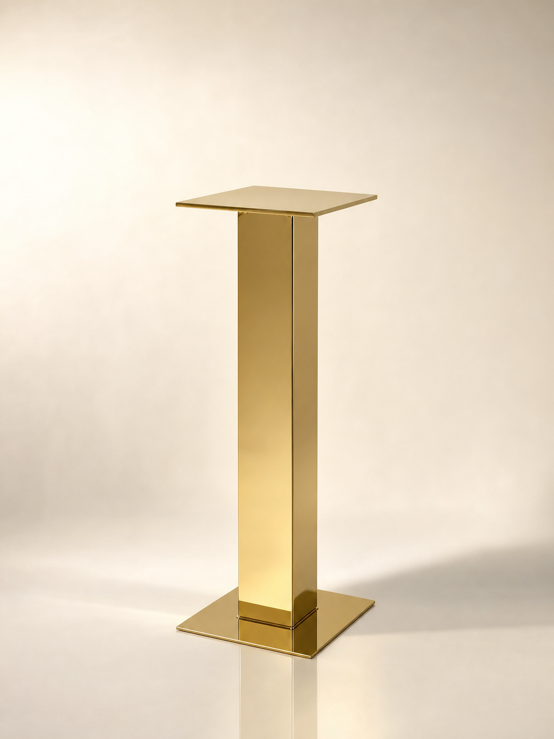 Slim tall gold pedestal cocktail table with mirror-gold column base